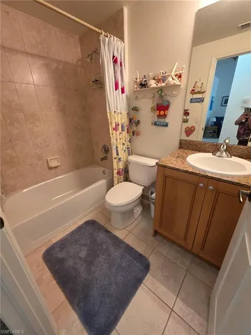 a bathroom with a tub sink mirror and vanity