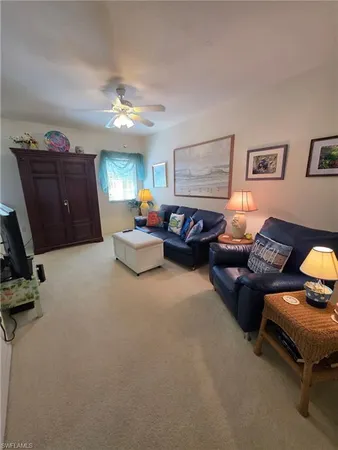 a living room with furniture and a lamp