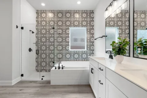 a bedroom with a bed and ceiling fan