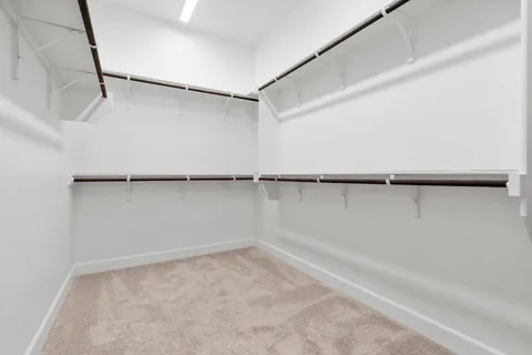 a bathroom with a bathtub sink and mirror