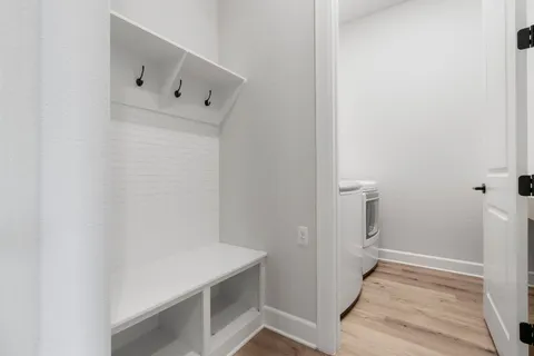 a bathroom with a sink toilet and a mirror