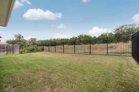 a view of a house with pool table and chairs