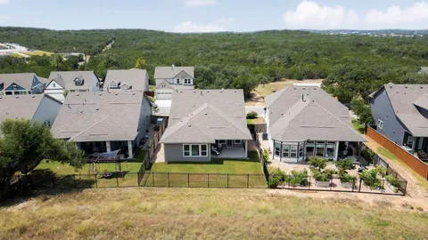 a view of a house with a garden and yard