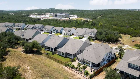 a view of multiple houses with a yard