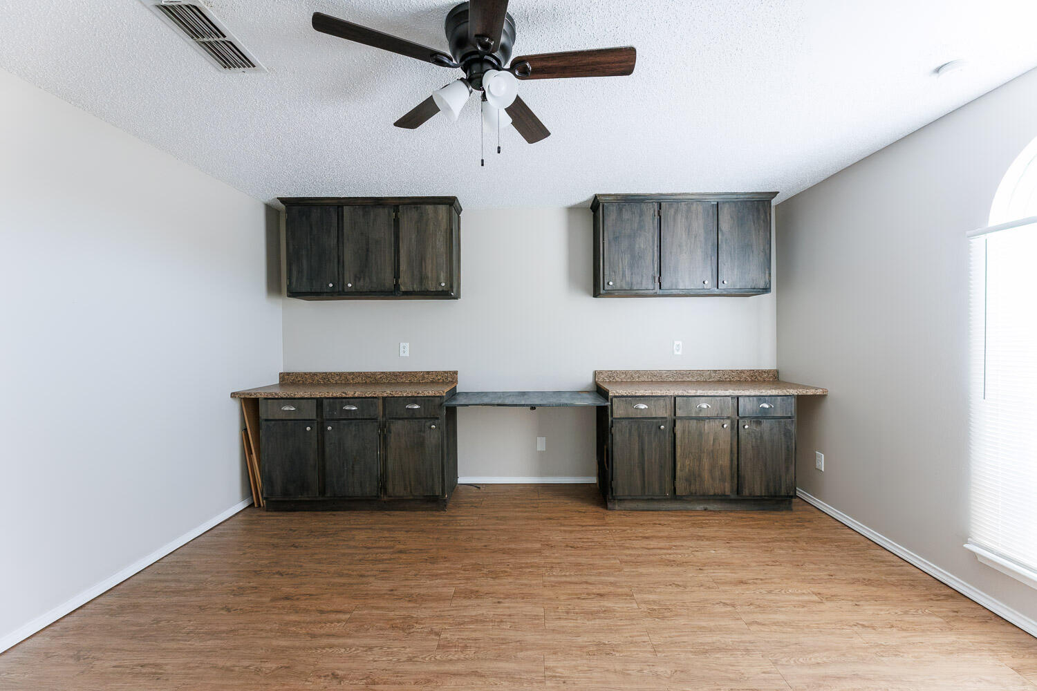 6704 87th Street Lubbock, TX 79424 - Photo 21 of 49 a kitchen with stainless steel appliances granite countertop a stove and a sink with granite countertops