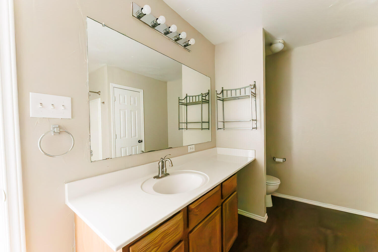6704 87th Street Lubbock, TX 79424 - Photo 33 of 49 a bathroom with a sink vanity granite and a mirror