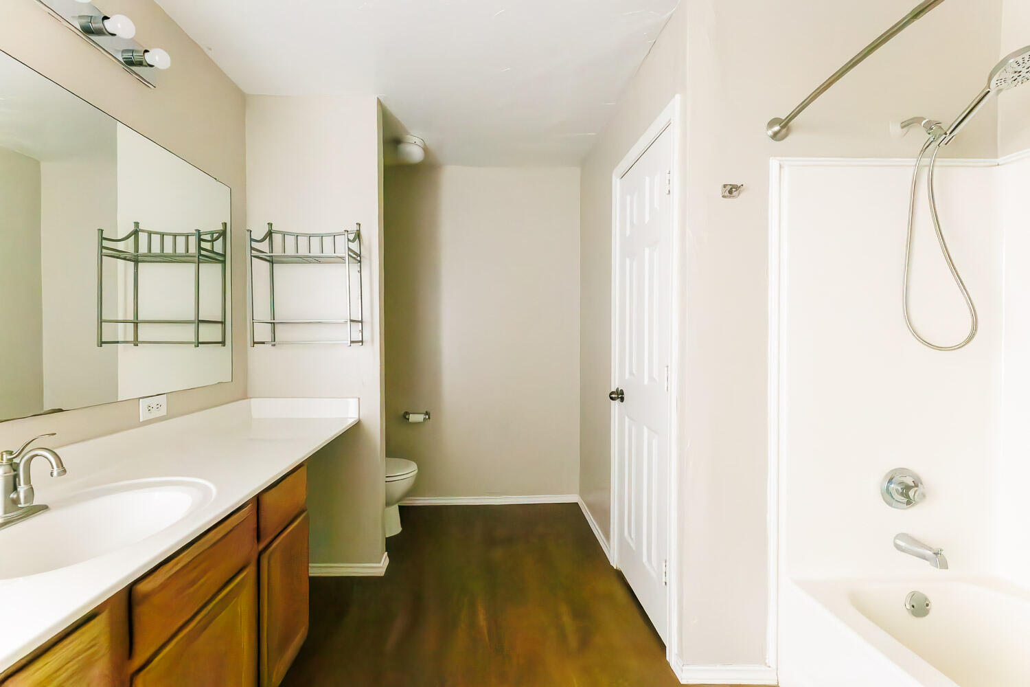 6704 87th Street Lubbock, TX 79424 - Photo 34 of 49 a bathroom with a granite countertop sink a toilet and shower