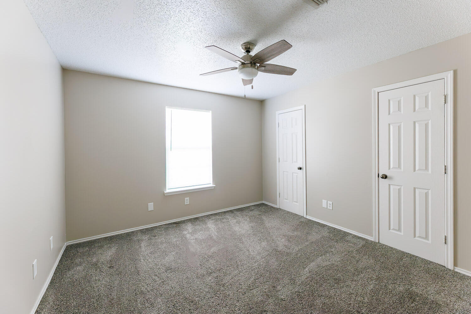 6704 87th Street Lubbock, TX 79424 - Photo 37 of 49 a view of an empty room with a window