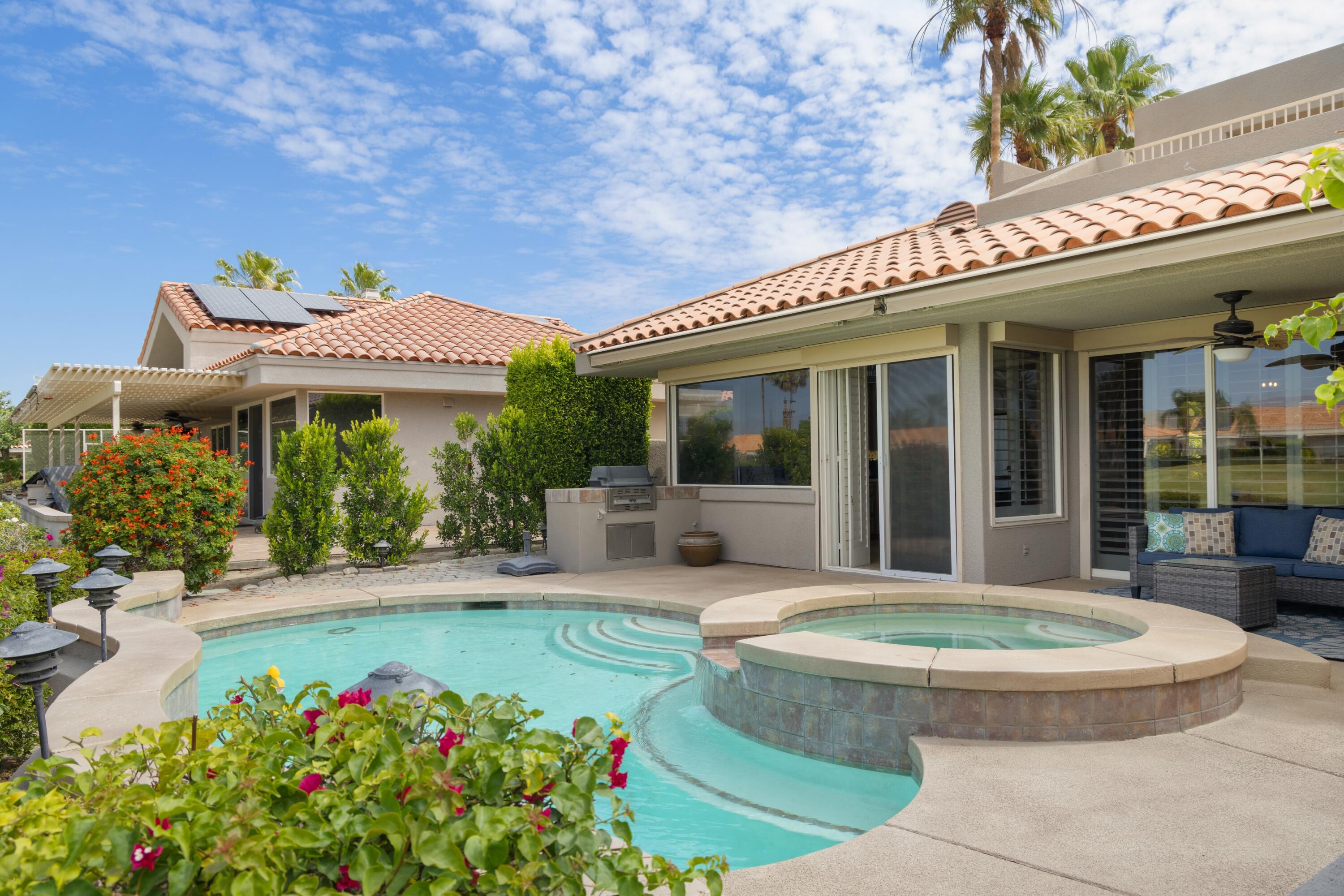 39 Augusta Drive Rancho Mirage, CA 92270 - Photo 48 of 53 a view of a house with swimming pool and sitting area