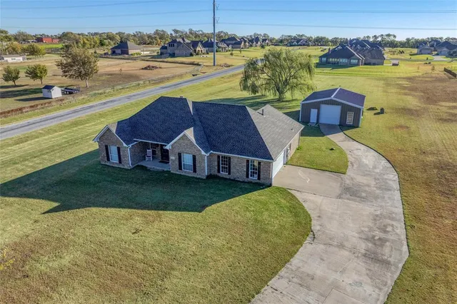 a view of a lake with a house in the background