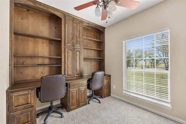 a workspace with furniture and a window