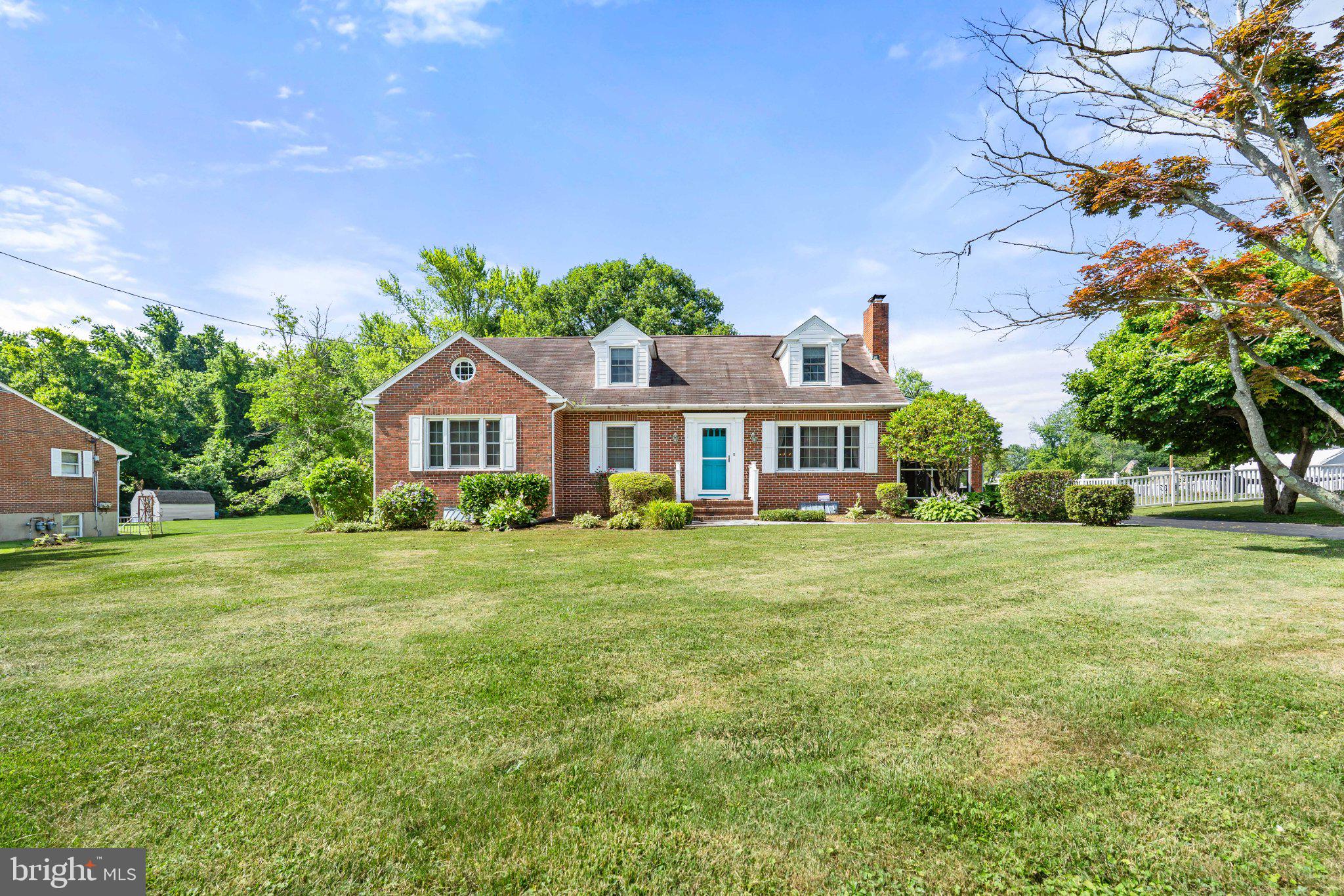806 Long Bar Harbor Road Abingdon, MD 21009 - Photo 4 of 41 Charming brick home with lush greenery.