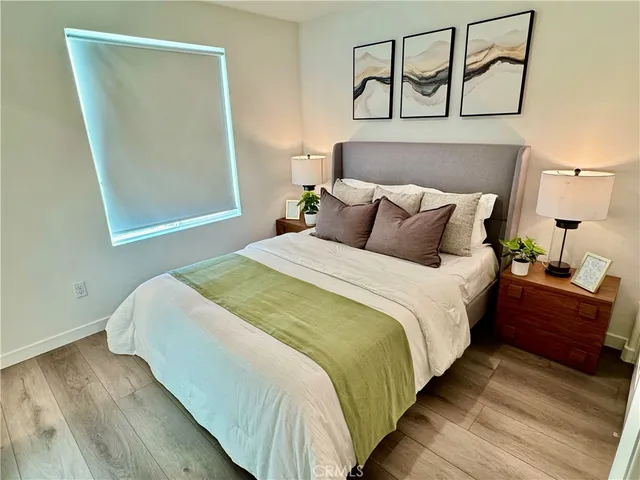 a bedroom with bed and window