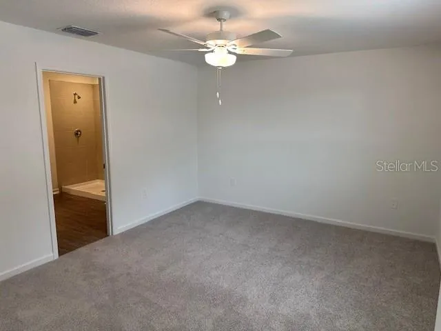 a view of a chandelier fan in a room