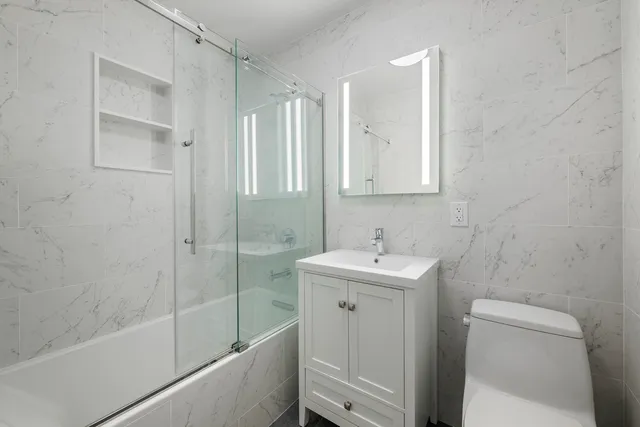 a bedroom with a bed and a table