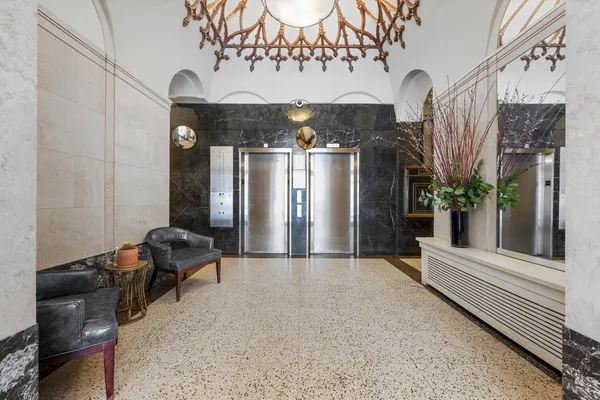 a view of kitchen and utility room with wooden floor