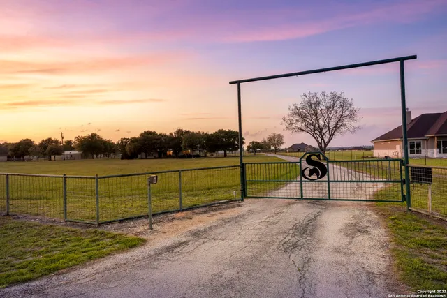 a view of park with iron fence
