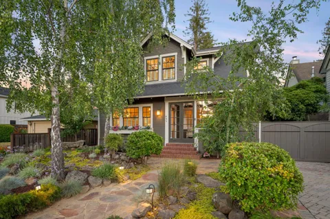 a front view of a house with garden