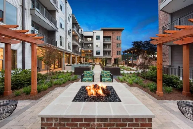 a view of a building with a yard balcony
