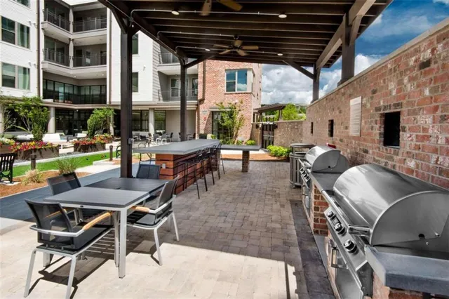 a view of a chairs and table in a patio