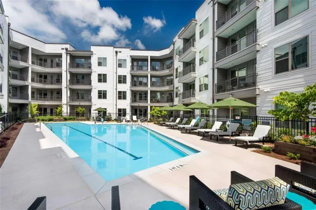 a view of a patio with swimming pool table and chairs