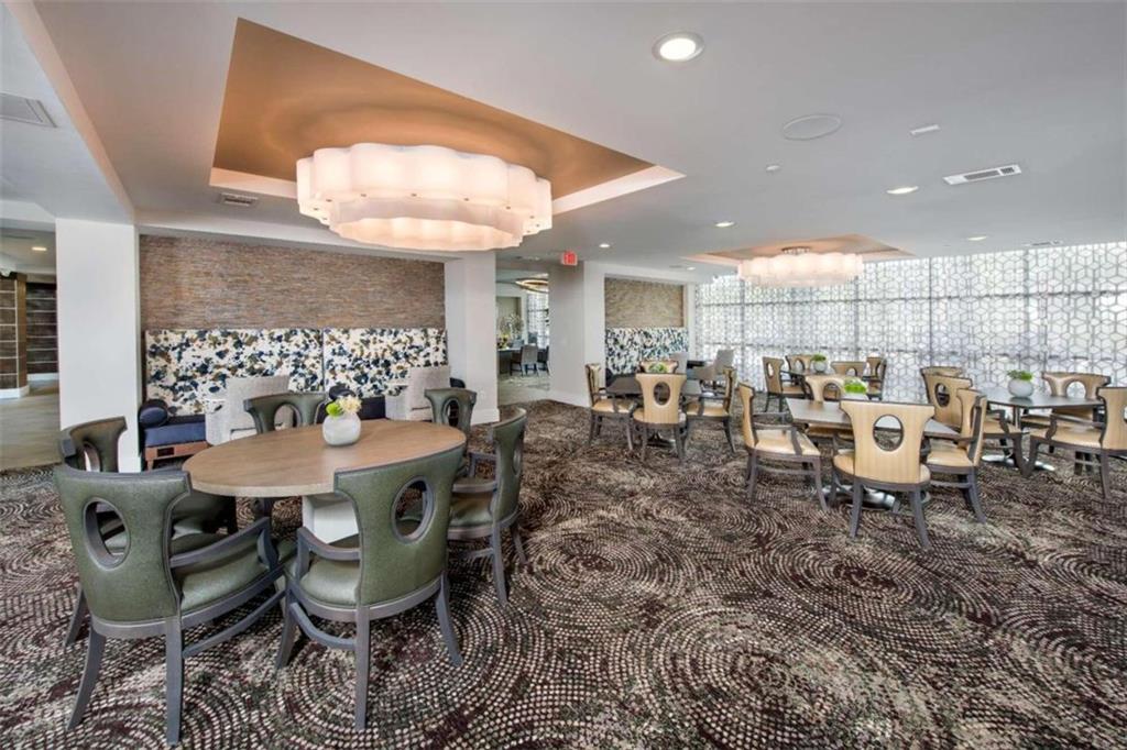 1490 Ernest W Barrett Parkway Northwest, Unit 314 Kennesaw, GA 30152 - Photo 8 of 30 a view of a dining room with furniture