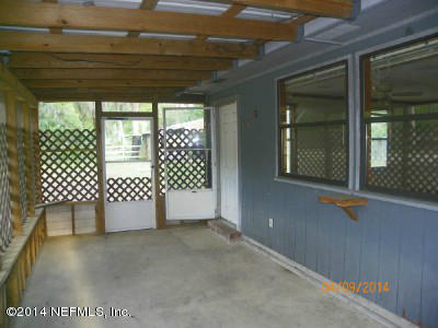 96770 Chester Road Yulee, FL 32097 - Photo 11 of 12 a view of a black and white door