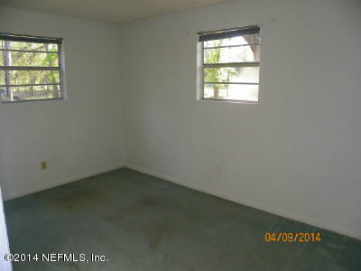 96770 Chester Road Yulee, FL 32097 - Photo 8 of 12 an empty room with a window