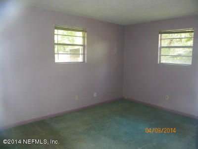 96770 Chester Road Yulee, FL 32097 - Photo 9 of 12 an empty room with a window