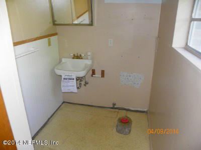 96770 Chester Road Yulee, FL 32097 - Photo 10 of 12 a bathroom with a sink and a mirror