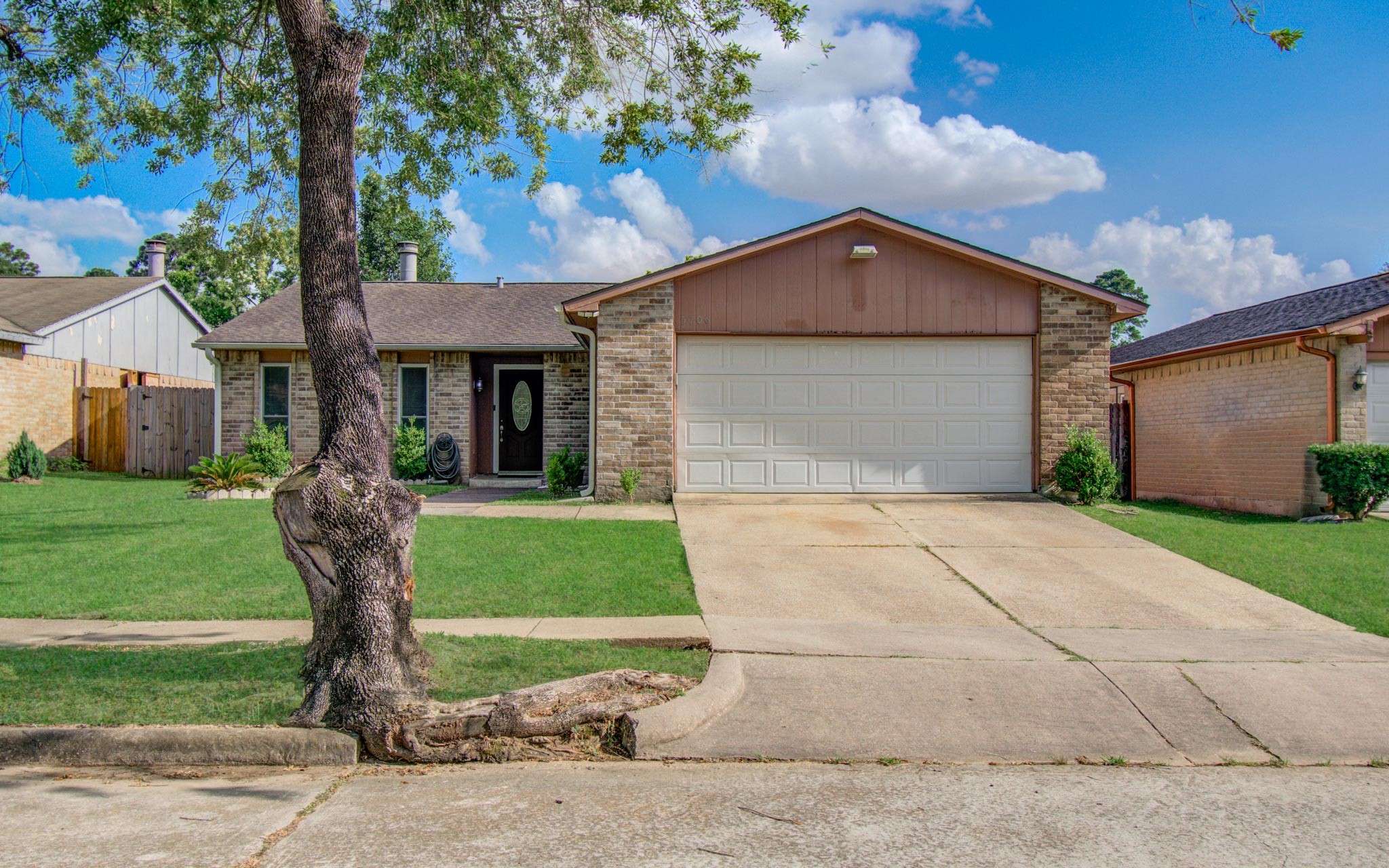 5706 Spring Grove Lane Spring, TX 77373 - Photo 3 of 12 a front view of a house with garden