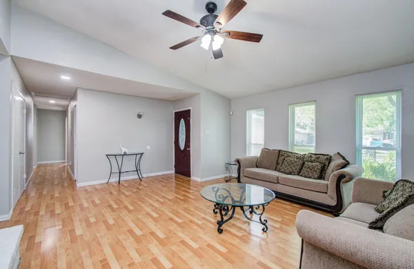 a living room with furniture and a table