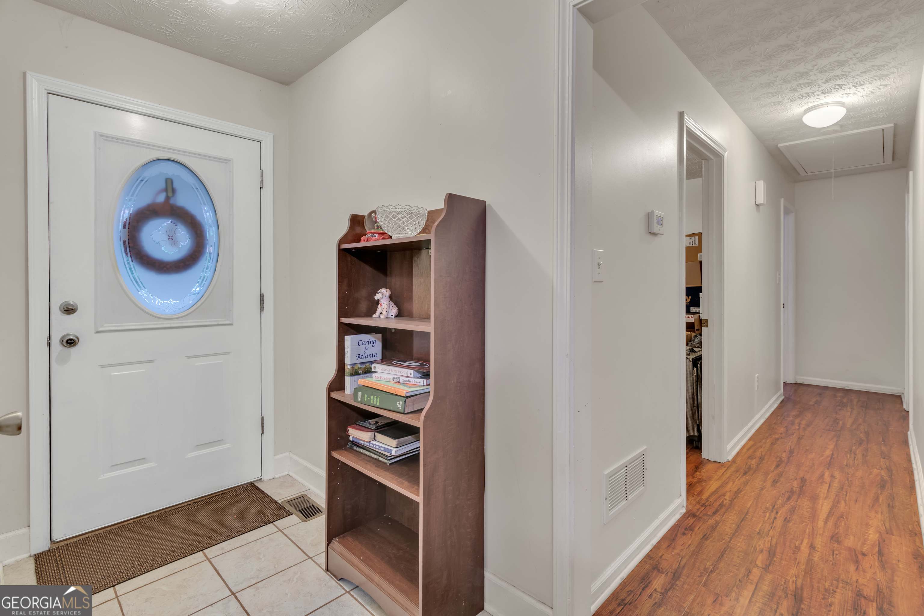 66 Ellis Trail Covington, GA 30016 - Photo 16 of 39 a view of kitchen and wooden floor