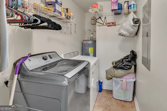 a living room with lots of furniture and kitchen view