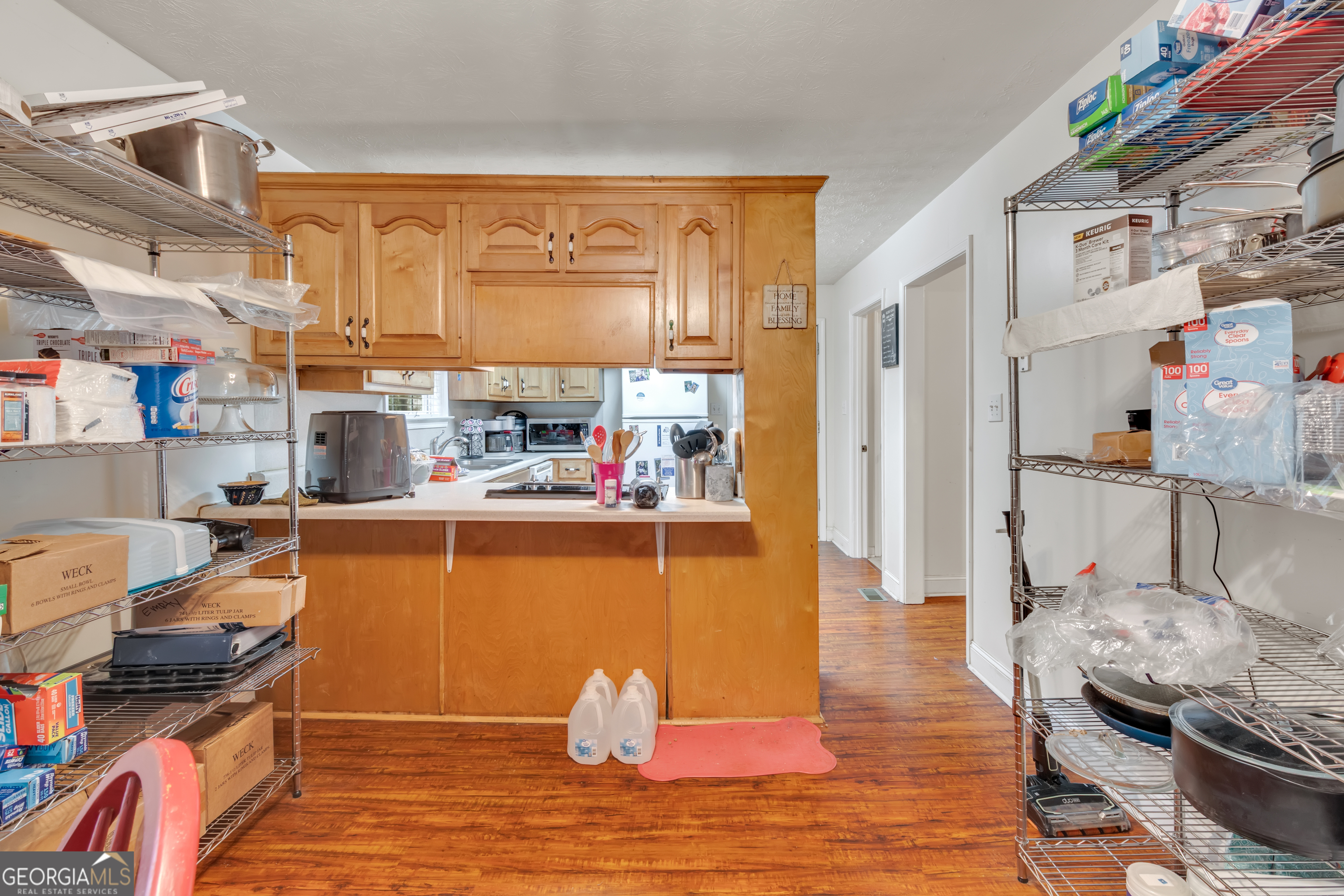 66 Ellis Trail Covington, GA 30016 - Photo 27 of 39 a living room with stainless steel appliances furniture stove and a kitchen view