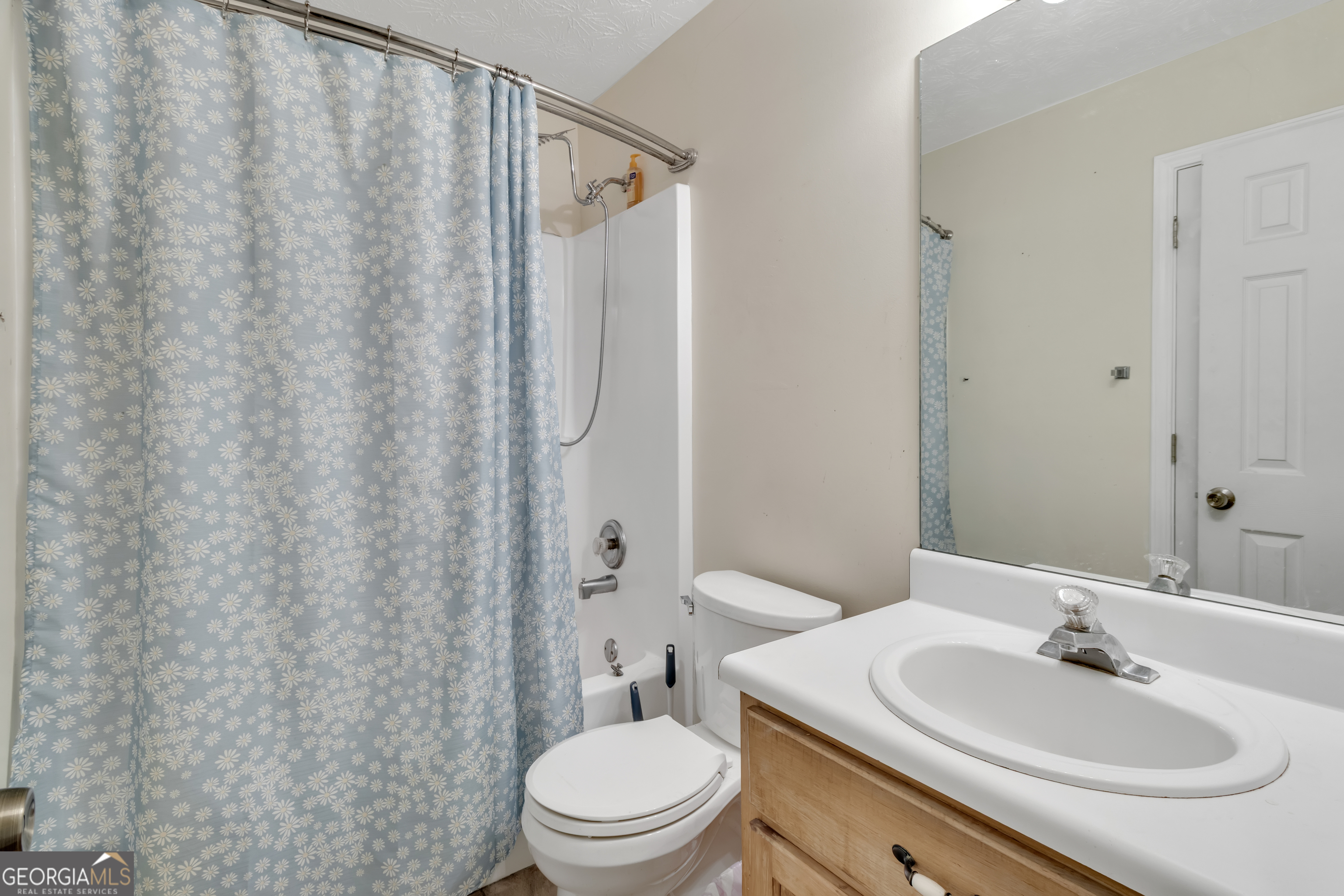 66 Ellis Trail Covington, GA 30016 - Photo 29 of 39 a bathroom with a sink toilet and shower