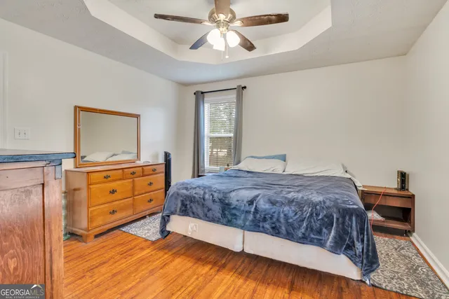 a bedroom with a bed and a couch