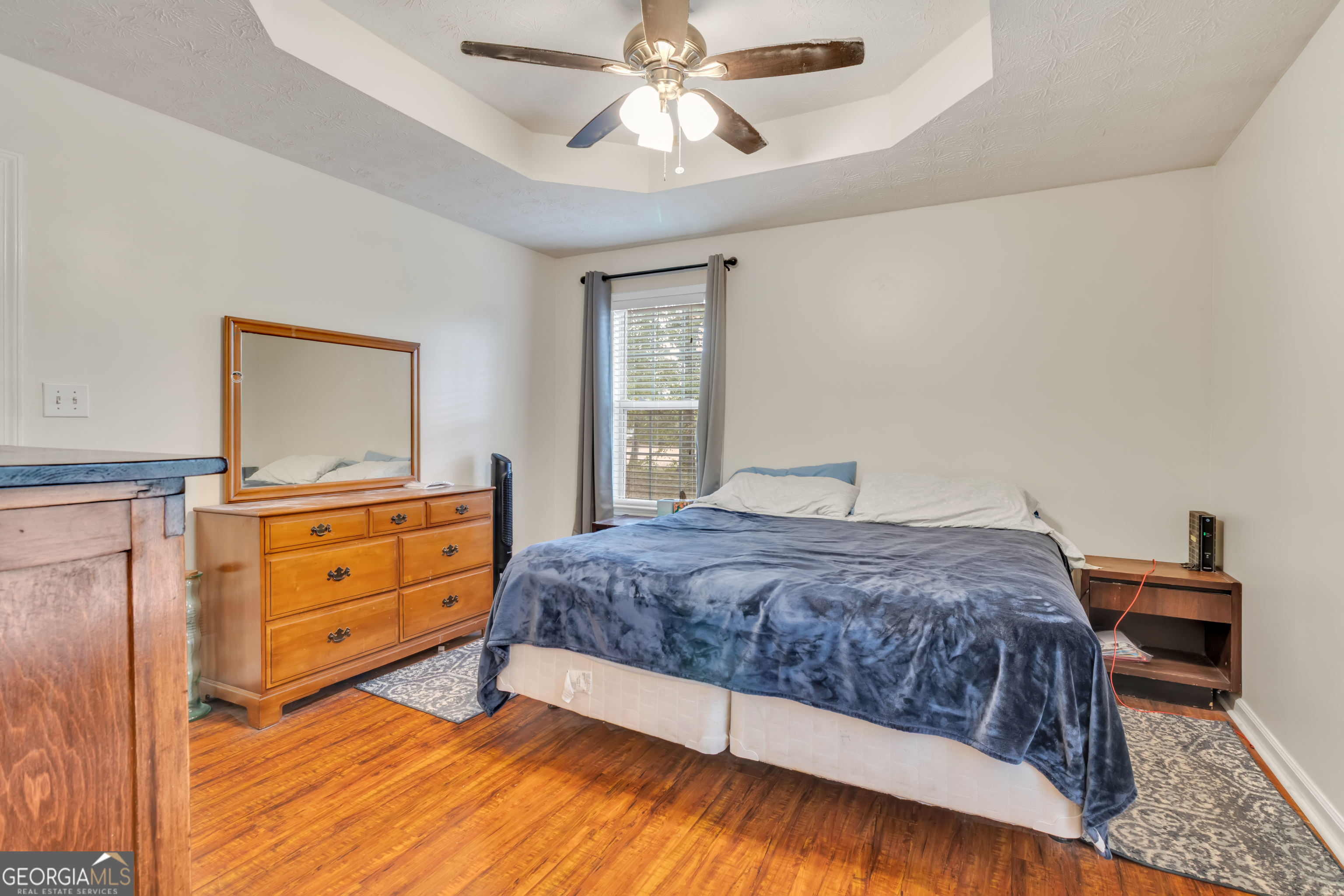 66 Ellis Trail Covington, GA 30016 - Photo 33 of 39 a bedroom with a bed and a dresser