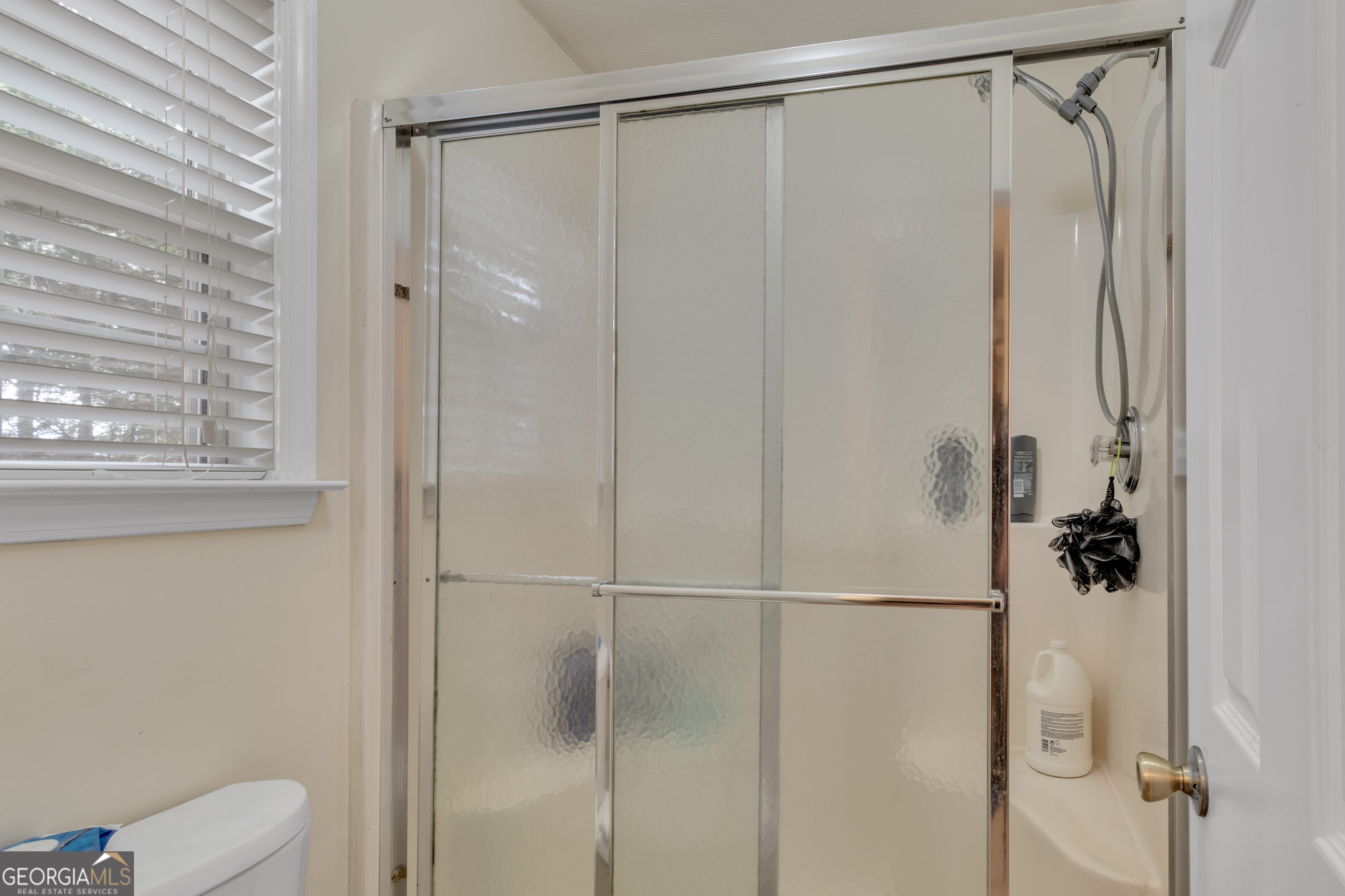 66 Ellis Trail Covington, GA 30016 - Photo 36 of 39 a bathroom with a shower and a toilet