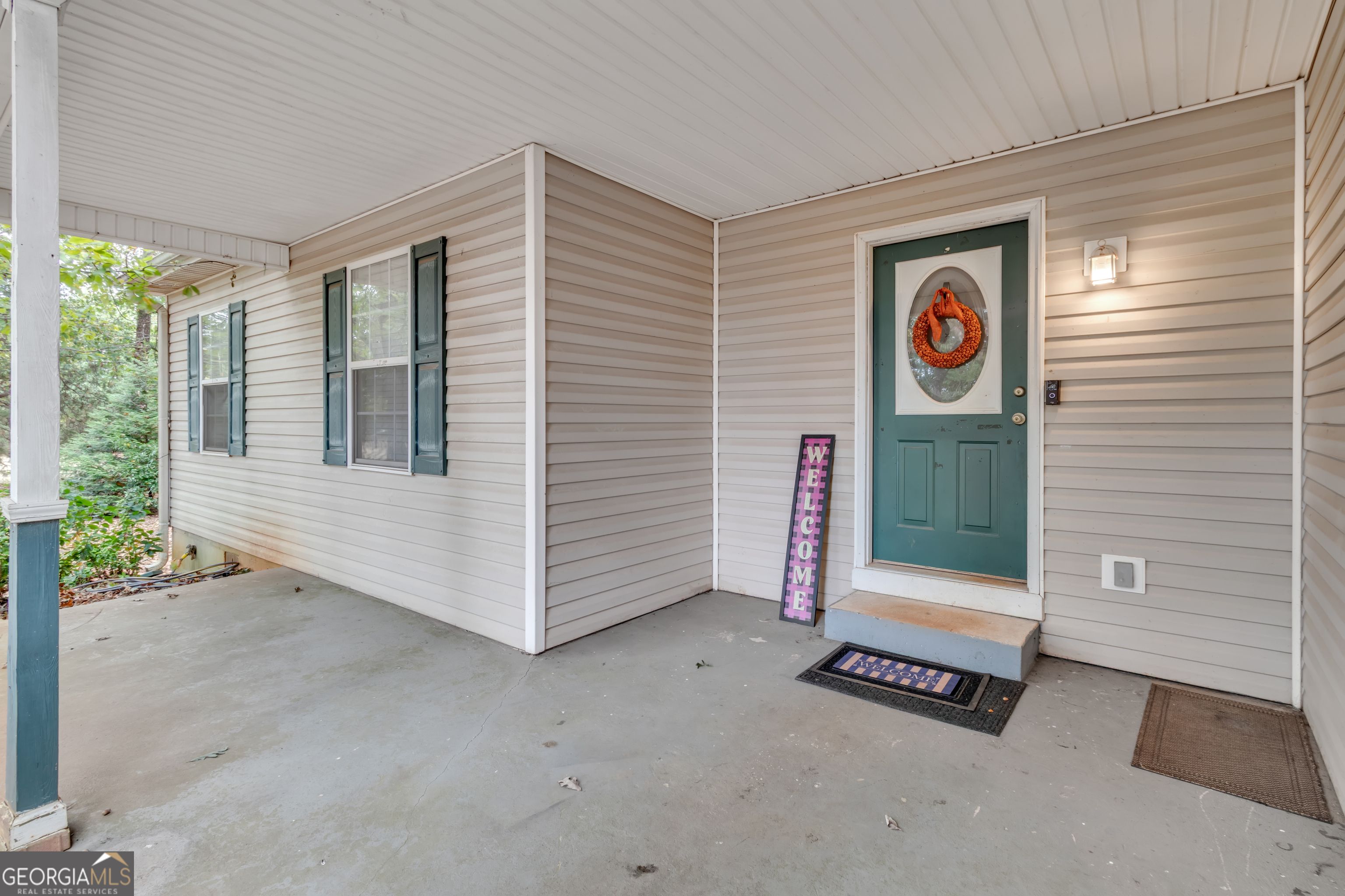66 Ellis Trail Covington, GA 30016 - Photo 38 of 39 a view of an entrance to house with yard