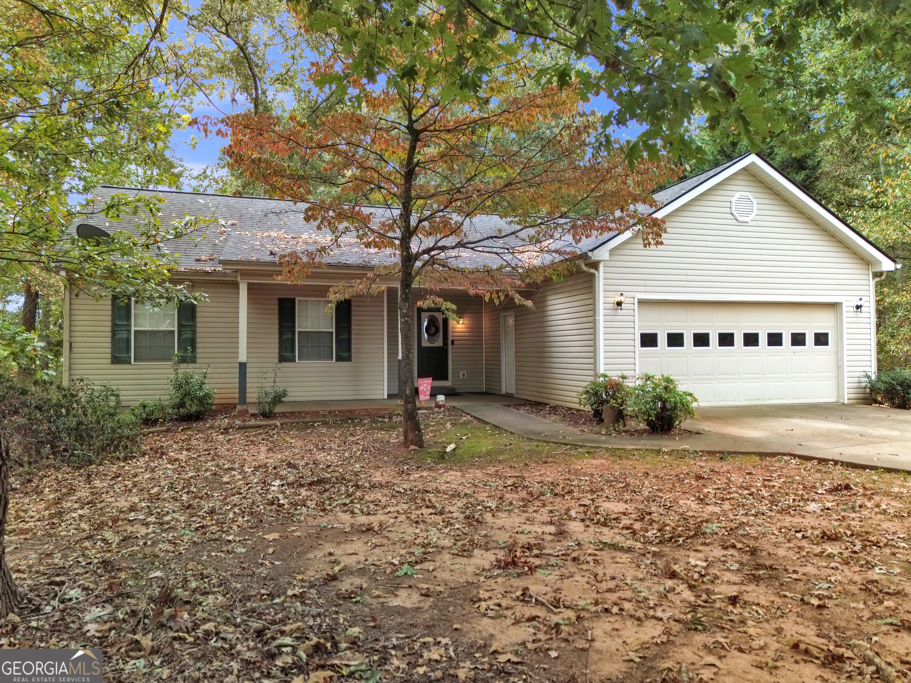 66 Ellis Trail Covington, GA 30016 - Photo 4 of 39 a view of a house with a yard and large tree