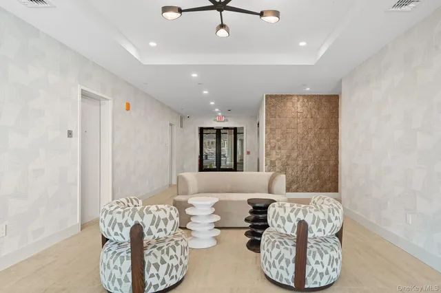 a living room with furniture and a window