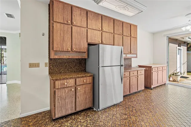 a big room with wooden floor and windows