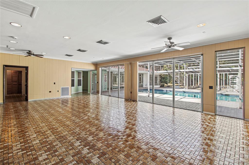 2605 Desoto Road Sarasota, FL 34243 - Photo 16 of 27 a big room with wooden floor and windows