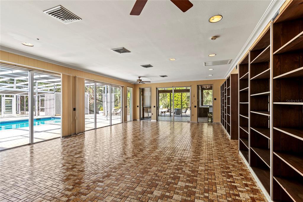 2605 Desoto Road Sarasota, FL 34243 - Photo 19 of 27 a view of empty room with wooden floor and fan