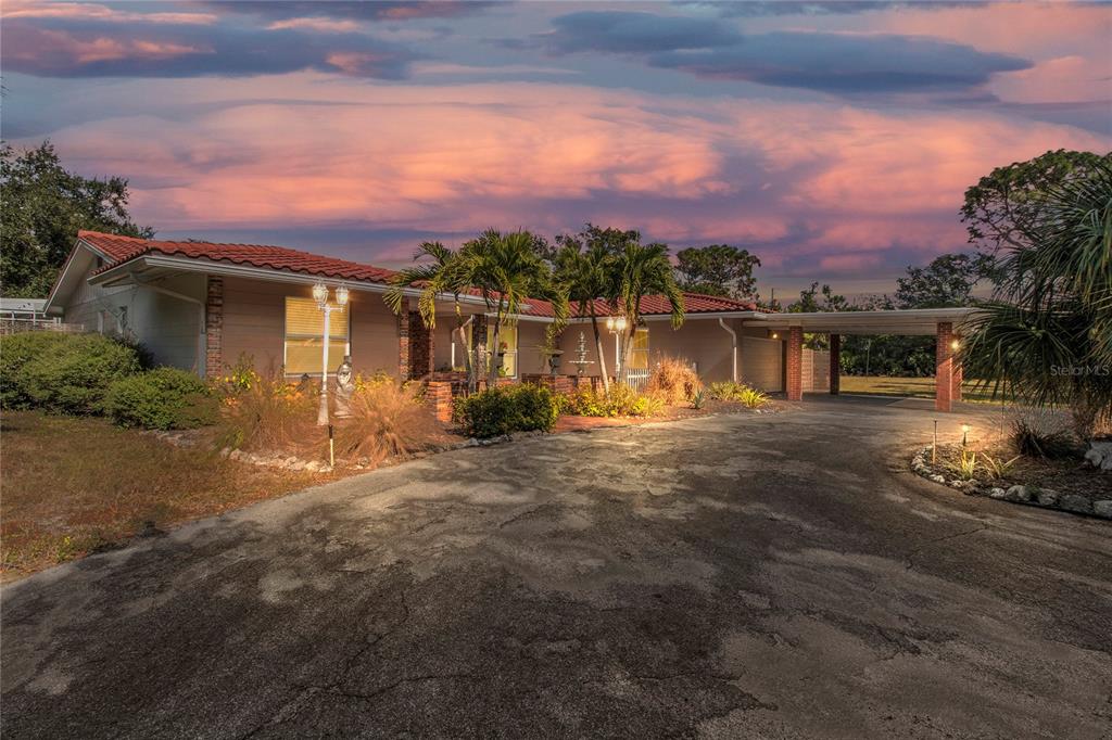 2605 Desoto Road Sarasota, FL 34234 - Photo 2 of 27 a front view of a house with a lake view