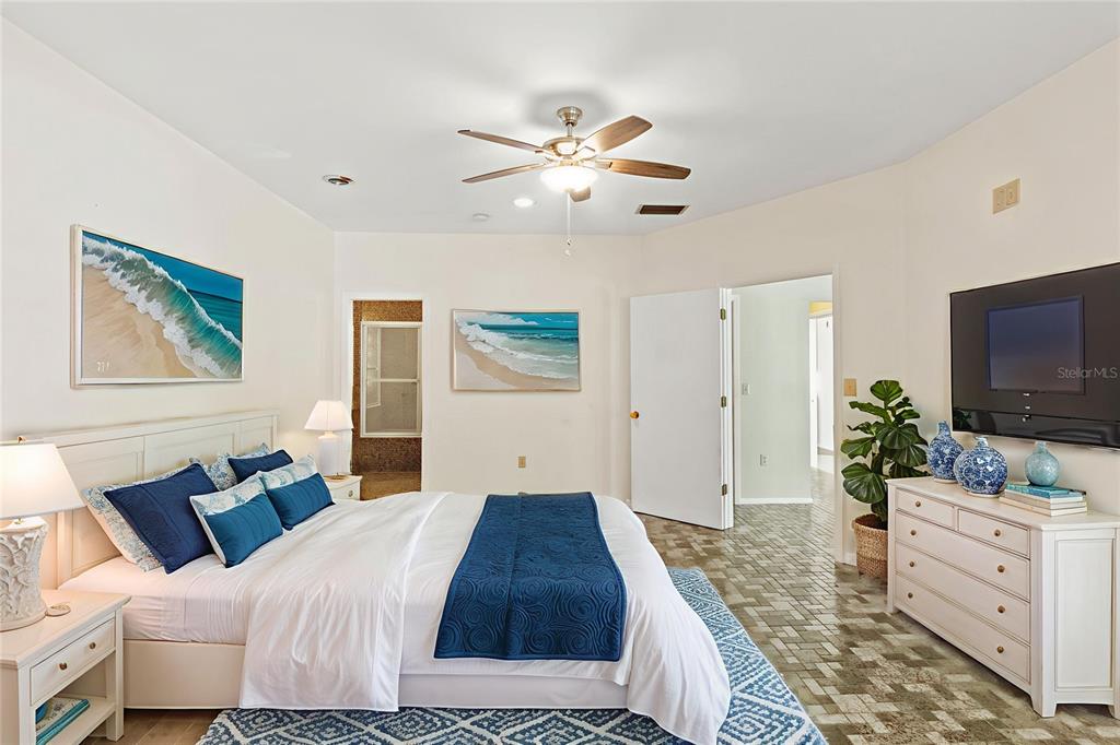 2605 Desoto Road Sarasota, FL 34243 - Photo 22 of 27 a bedroom with a bed and a flat screen tv