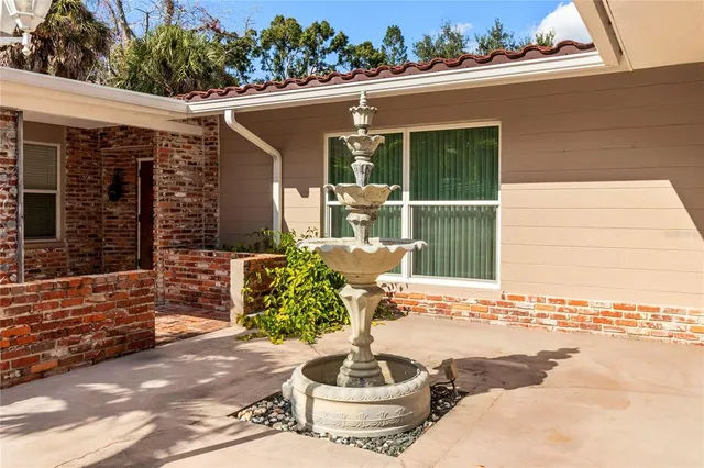 an empty room with large windows