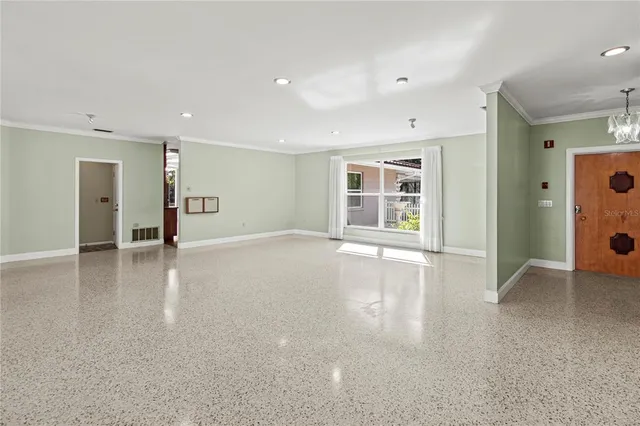 a view of a dining room with furniture and window