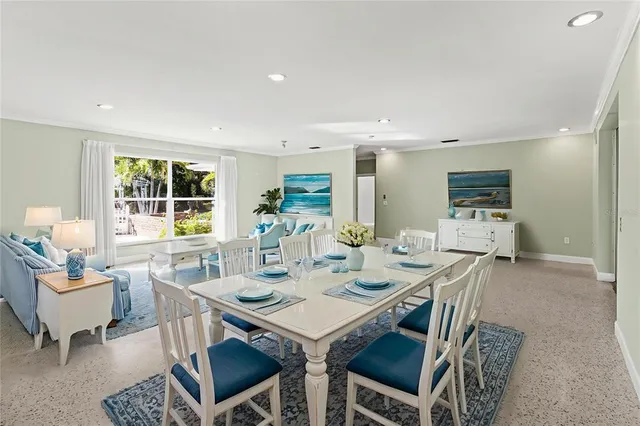 a kitchen with stainless steel appliances granite countertop a sink a stove cabinets and a kitchen island